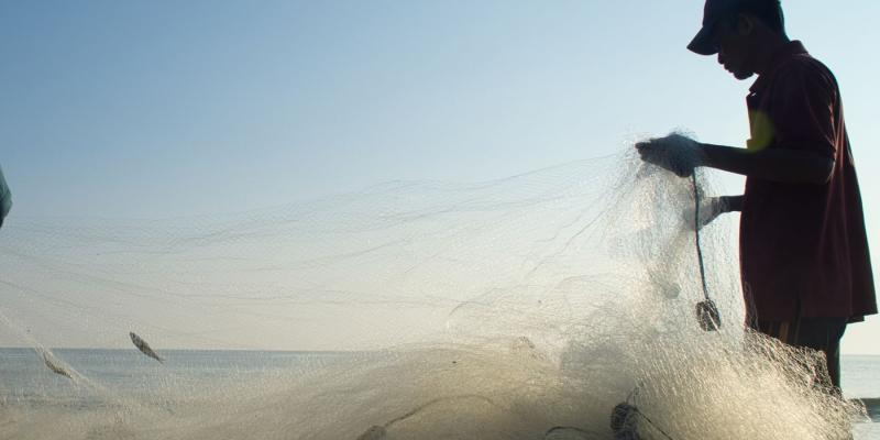 Two fishermen with net